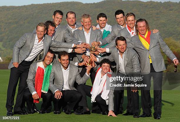 European Team Captain Colin Montgomerie poses with the Ryder Cup and his team following Europe's 14.5 to 13.5 victory over the USA at the 2010 Ryder...