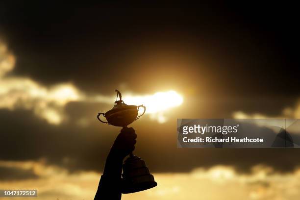 Thomas Bjorn lifts the Ryder Cup Trophy aloft after Europe secure victory after the singles matches of the 2018 Ryder Cup at Le Golf National on...
