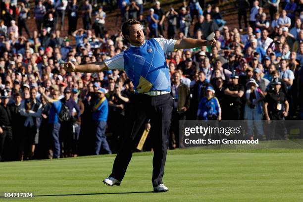 Graeme McDowell of Europe celebrates his birdie putt on the 16th green in the singles matches during the 2010 Ryder Cup at the Celtic Manor Resort on...