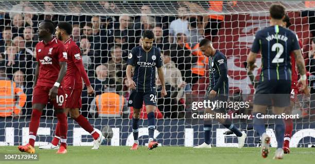 Manchester City's Riyad Mahrez rues a missed opportunity after lifting his late penalty effort high over the Liverpool goal during the Premier League...