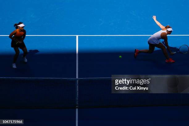 Gabriela Dabrowski of Canada and Xu Yifan of China hit a return during their Women's Doubles Finals match against Andrea Sestini Hlavackova and...