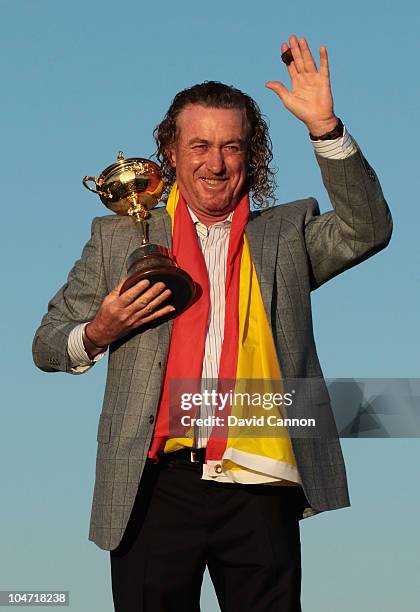 European Team member Miguel Angel Jimenez poses with the Ryder Cup following Europe's 14.5 to 13.5 victory over the USA at the 2010 Ryder Cup at the...