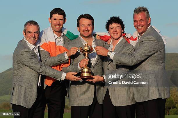 European Team members Paul McGinley, Padraig Harrington, Graeme McDowell, Rory McIlroy and Darren Clarke pose with the Ryder Cup following Europe's...