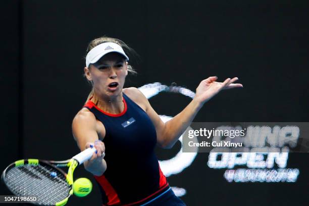 Caroline Wozniacki of Denmark hits a return during the Women's Singles Finals match against Anastasija Sevastova of Latvia on day nine of the 2018...