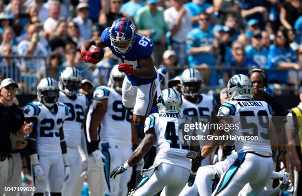 Sterling Shepard of the New York Giants leaps against the Carolina Panthers in the second quarter during their game at Bank of America Stadium on...