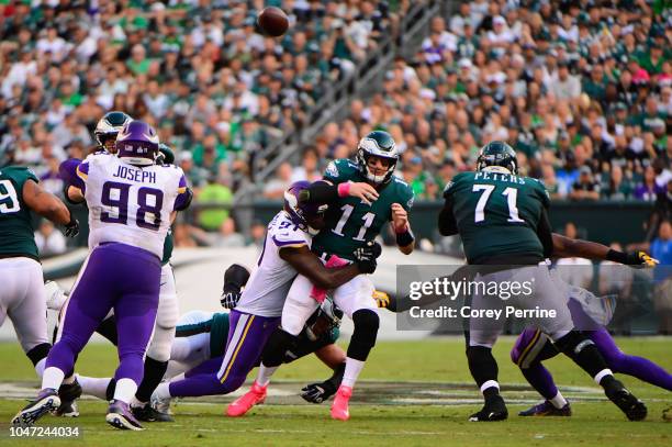 Quarterback Carson Wentz of the Philadelphia Eagles is sacked by defensive end Stephen Weatherly of the Minnesota Vikings during the second quarter...