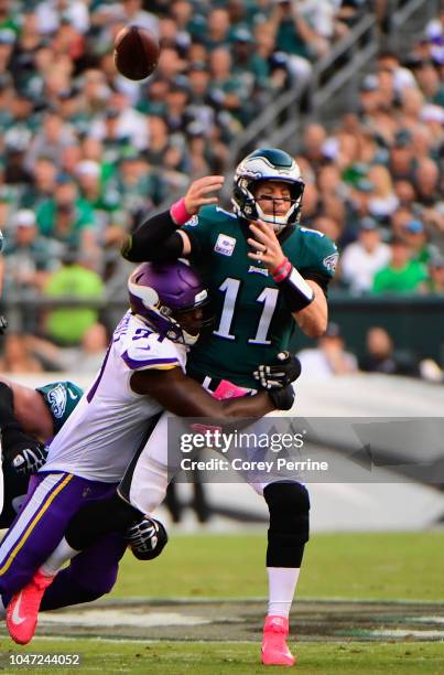 Quarterback Carson Wentz of the Philadelphia Eagles is sacked by defensive end Stephen Weatherly of the Minnesota Vikings during the second quarter...