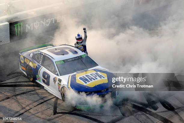 Chase Elliott, driver of the NAPA Auto Parts Chevrolet, celebrates winning the Monster Energy NASCAR Cup Series Gander Outdoors 400 at Dover...