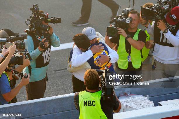 Chase Elliott, driver of the NAPA Auto Parts Chevrolet, celebrates with team owner and NASCAR Hall of Famer Rick Hendrick after winning the Monster...