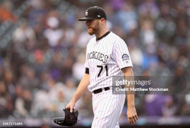 Pitcher Wade Davis of the Colorado Rockies leaves the game in the ninth inning of Game Three of the National League Division Series against the...