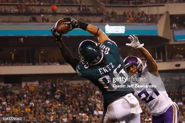 Tight end Zach Ertz of the Philadelphia Eagles makes a touchdown catch against cornerback Mike Hughes of the Minnesota Vikings during the fourth...