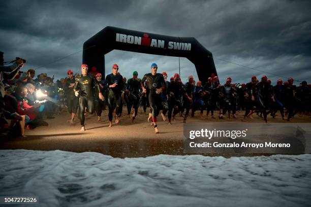 Pro male athletes start the swimming course of the Ironman Barcelona 2018 on October 7, 2018 in Calella, near Barcelona, Spain.