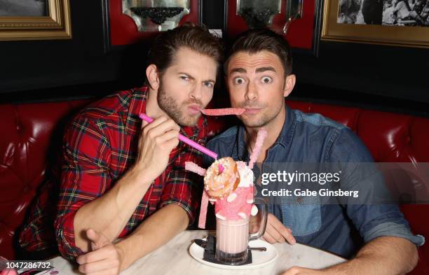 Television personality Jaymes Vaughan and actor and model Jonathan Bennett share a milkshake during "The Burn Cookbook" signing event at Sugar...