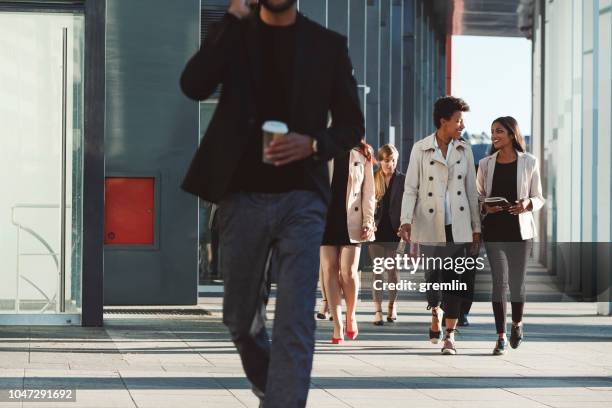 business people walking on the street - business park stock pictures, royalty-free photos & images
