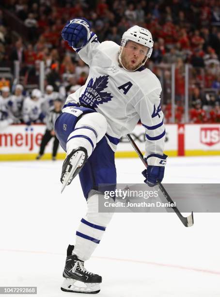 Morgan Rielly of the Toronto Maple Leafs celebrsates his game winning goal in overtime against the Chicago Blackhawks during the regular seasopn...