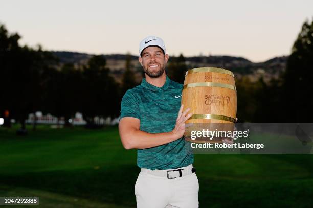 Kevin Tway poses with the trophy after putting in to win on a third hole sudden death playoff against Ryan Moore during the final round of the...