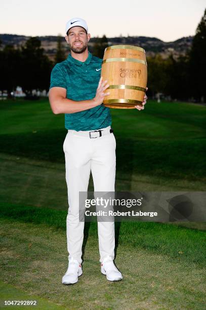 Kevin Tway poses with the trophy after putting in to win on a third hole sudden death playoff against Ryan Moore during the final round of the...
