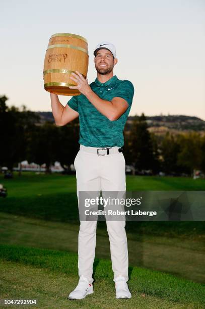 Kevin Tway poses with the trophy after putting in to win on a third hole sudden death playoff against Ryan Moore during the final round of the...