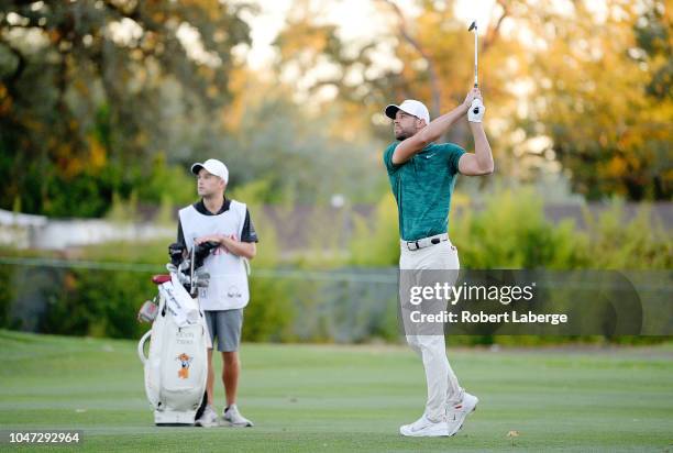 Kevin Tway plays his shot on a third hole sudden death playoff against Ryan Moore on the 10th fairway during the final round of the Safeway Open at...