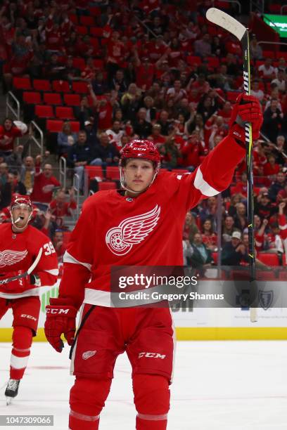 Dennis Cholowski of the Detroit Red Wings celebrates his first NHL goal in the first period while playing the Columbus Blue Jackets at Little Caesars...