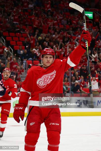 Dennis Cholowski of the Detroit Red Wings celebrates his first NHL goal in the first period while playing the Columbus Blue Jackets at Little Caesars...