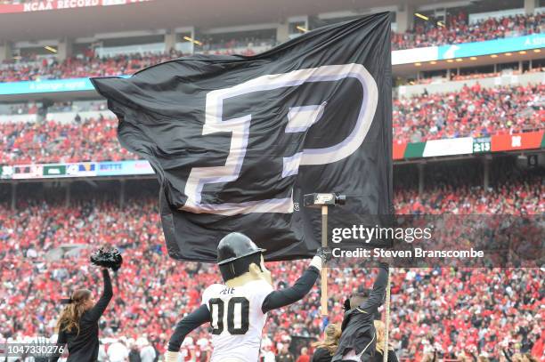 The mascot of the Purdue Boilermakers runs with the flag after a score against the Nebraska Cornhuskers at Memorial Stadium on September 29, 2018 in...