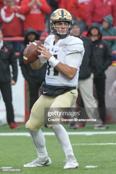 Quarterback David Blough of the Purdue Boilermakers drops back to pass against the Nebraska Cornhuskers at Memorial Stadium on September 29, 2018 in...