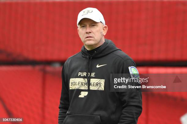 Head coach Jeff Brohm of the Purdue Boilermakers watches warm ups before the game against the Nebraska Cornhuskers at Memorial Stadium on September...