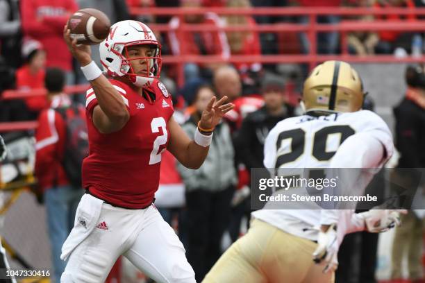 Quarterback Adrian Martinez of the Nebraska Cornhuskers passes against cornerback Simeon Smiley of the Purdue Boilermakers at Memorial Stadium on...