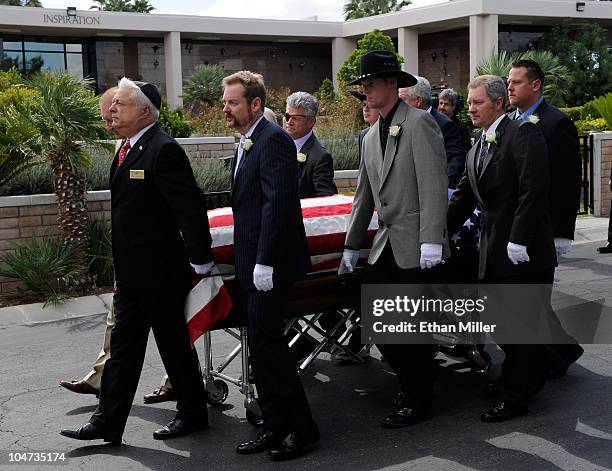 Pallbearers move Tony Curtis' coffin to his burial site at Palm Mortuary & Cemetary October 4, 2010 in Henderson, Nevada. Curtis died on September 29...