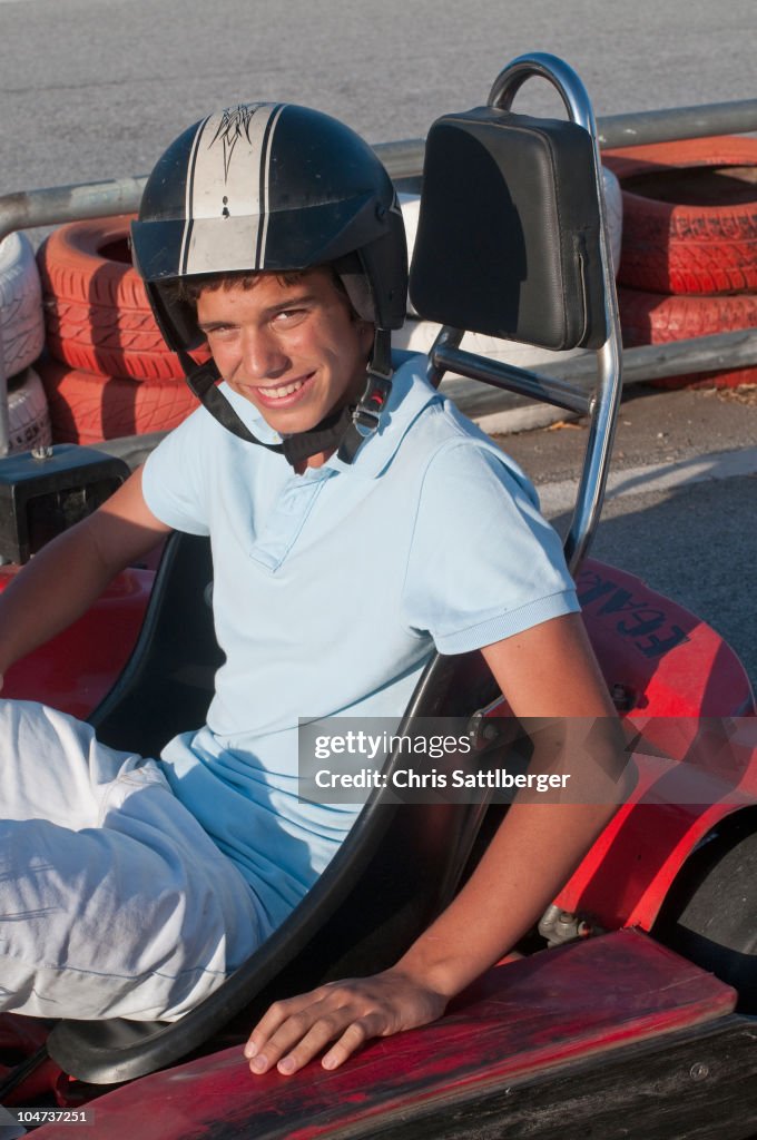 Hispanic teenager on go-cart track