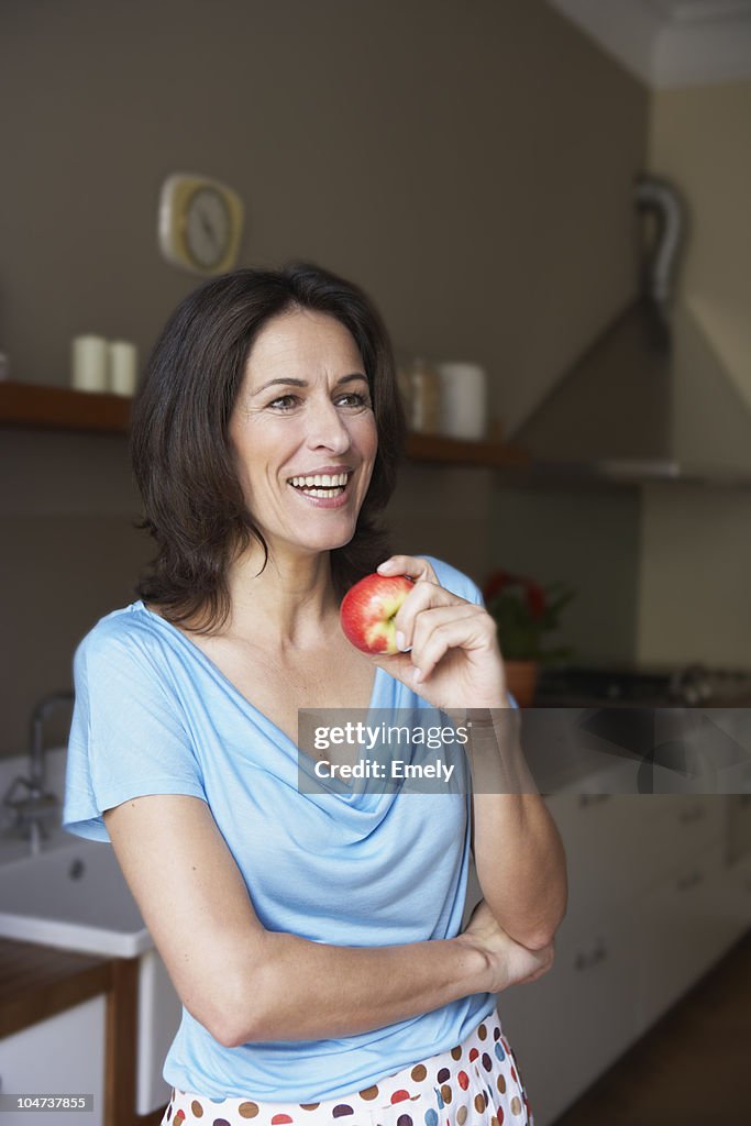 Woman going to eat apple