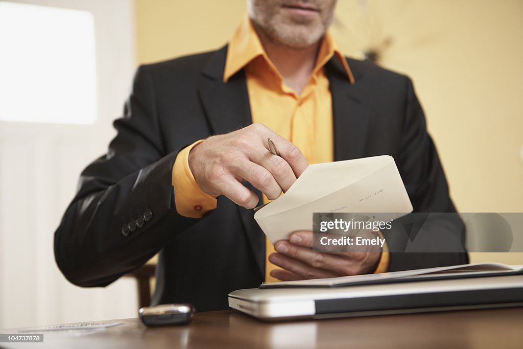 Man opening letter