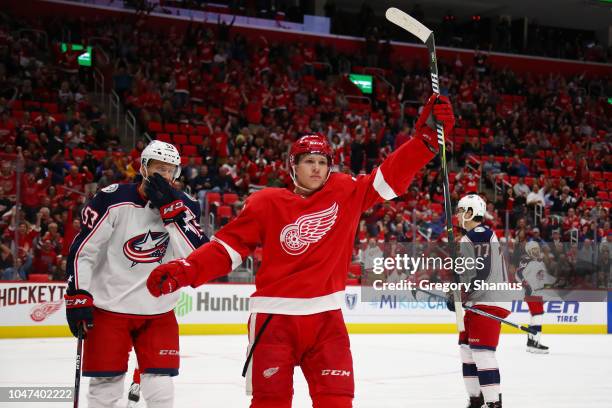 Dennis Cholowski of the Detroit Red Wings celebrates his first NHL goal in the first period while playing the Columbus Blue Jackets at Little Caesars...