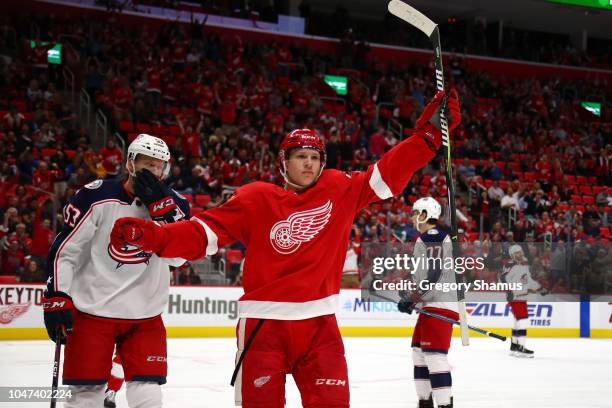 Dennis Cholowski of the Detroit Red Wings celebrates his first NHL goal in the first period while playing the Columbus Blue Jackets at Little Caesars...
