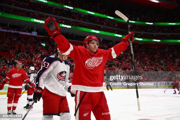 Dennis Cholowski of the Detroit Red Wings celebrates his first NHL goal in the first period while playing the Columbus Blue Jackets at Little Caesars...