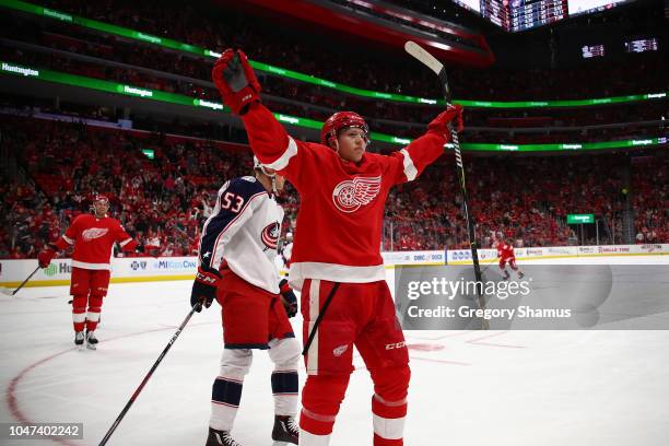 Dennis Cholowski of the Detroit Red Wings celebrates his first NHL goal in the first period while playing the Columbus Blue Jackets at Little Caesars...