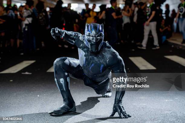 Fan cosplays as Black Panther from the Marvel Universe during the 2018 New York Comic-Con at Javits Center on October 7, 2018 in New York City.