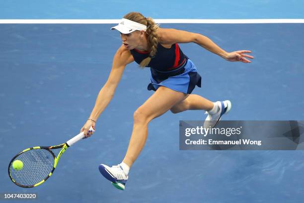 Caroline Wozniacki of Denmark returns a shot against Anastasija Sevastova of Latvia during the Women's Singles Finals match on day 9 of the 2018...