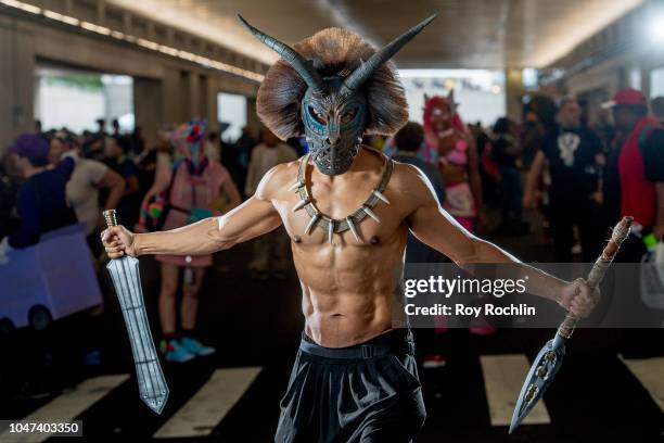 Fan cosplays as Erik Killmonger from Black Panther and the Marvel Universe during the 2018 New York Comic-Con at Javits Center on October 7, 2018 in...