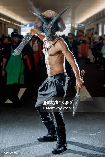 Fan cosplays as Erik Killmonger from Black Panther and the Marvel Universe during the 2018 New York Comic-Con at Javits Center on October 7, 2018 in...