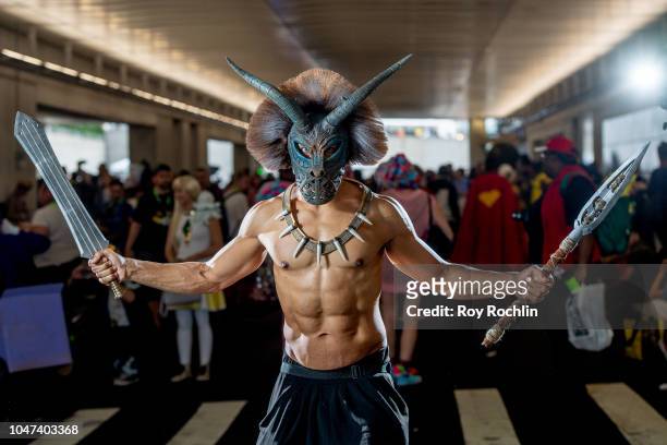 Fan cosplays as Erik Killmonger from Black Panther and the Marvel Universe during the 2018 New York Comic-Con at Javits Center on October 7, 2018 in...