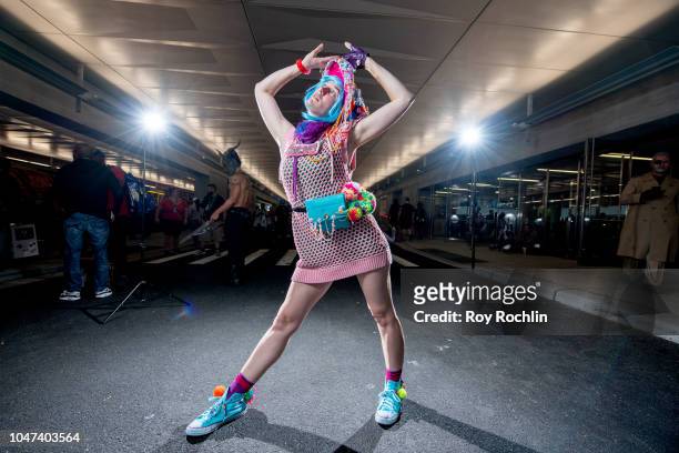 Fan cosplays as Bulma from Dragon Ball Z during the 2018 New York Comic-Con at Javits Center on October 7, 2018 in New York City.