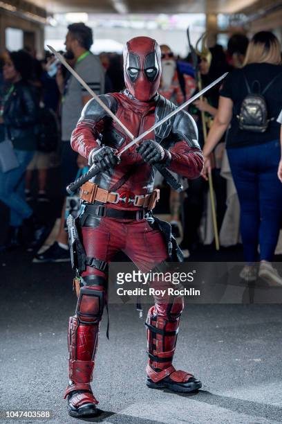 Fan cosplays as Deadpool from the Marvel Universe during the 2018 New York Comic-Con at Javits Center on October 7, 2018 in New York City.