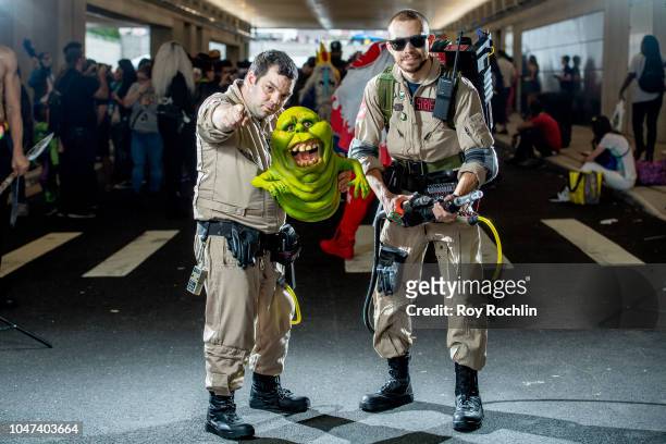 Fans cosplay as the Ghostbusters during the 2018 New York Comic-Con at Javits Center on October 7, 2018 in New York City.