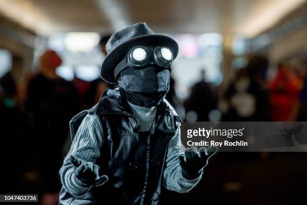 Fan cosplays as Spider-Man Noir from the Marvel Universe during the 2018 New York Comic-Con at Javits Center on October 7, 2018 in New York City.