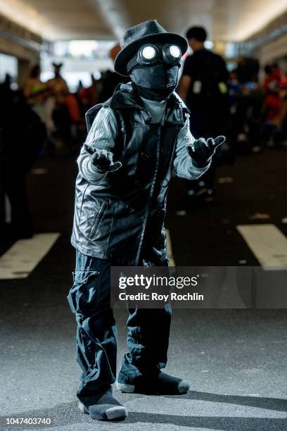 Fan cosplays as Spider-Man Noir from the Marvel Universe during the 2018 New York Comic-Con at Javits Center on October 7, 2018 in New York City.