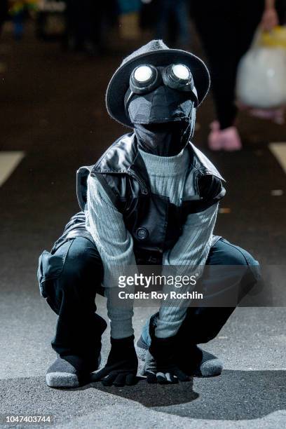 Fan cosplays as Spider-Man Noir from the Marvel Universe during the 2018 New York Comic-Con at Javits Center on October 7, 2018 in New York City.