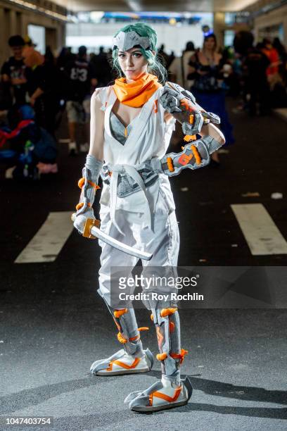 Fan cosplays as Genji from Overwatch during the 2018 New York Comic-Con at Javits Center on October 7, 2018 in New York City.