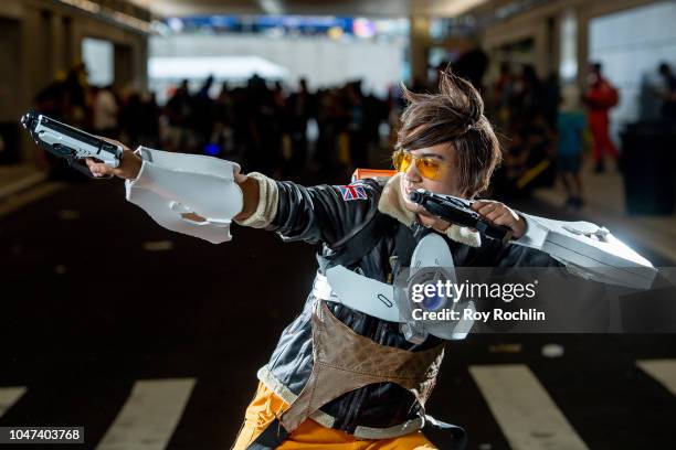 Fan cosplays as Tracer from Overwatch during the 2018 New York Comic-Con at Javits Center on October 7, 2018 in New York City.